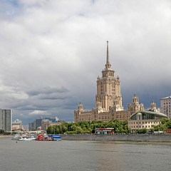 Fototapeta na wymiar Hotel Ukraine Radisson Collection opposite sky background