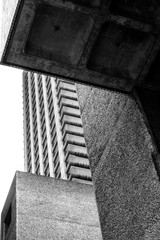 Brutalism and symmetry.
Black and white picture of a group of buildings in a big  residential city's blocks.