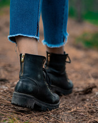 unisex black boots close-up photo