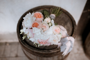 bride's bouquet of white flowers on a brown background