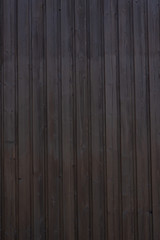 Naklejka premium Holzverkleidung dunkel vertikal