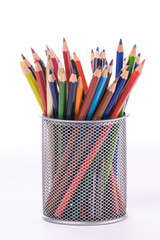 Colored pencils and pastel pencils arranged in a pencil case, in all kinds of colors for artists and graphic artists. Drawing and art tools in all colors: blue, yellow, green, turquoise, pink, purple,