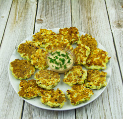 Chicken fritters with herbs and sauce