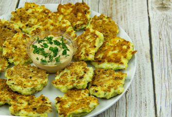 Chicken fritters with herbs and sauce
