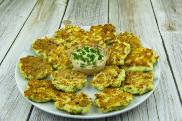 Chicken fritters with herbs and sauce