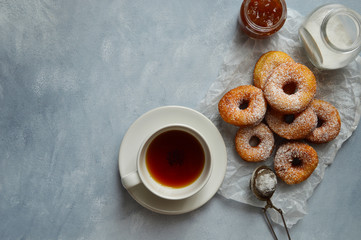 cup of tea with sugar donut