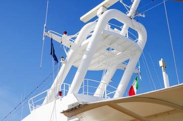 Mast with Italian flag of modern cruiseship or cruise ship liner