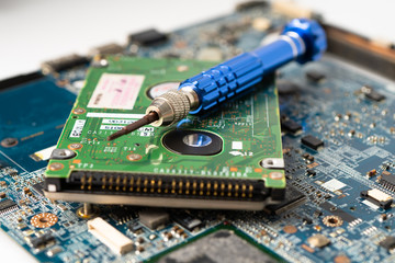 repairing inside of hard disk by soldering iron. Integrated Circuit. the concept of data, hardware,...
