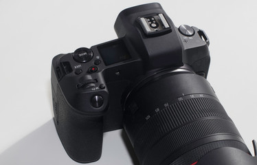 New generation of cameras mirrorless. Details on white bakground.