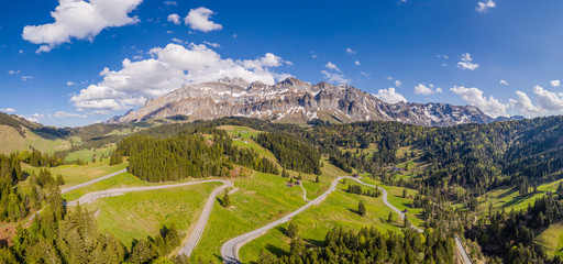 Aerail view of the Säntis (or Santis) mountain range landscape and schwägalp pass in Canton Appenzell in Switzerland on a sunny spring day