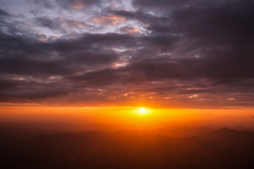 Sunset sunrise orange landscape in dramatic cloudy heaven sky aerial view
