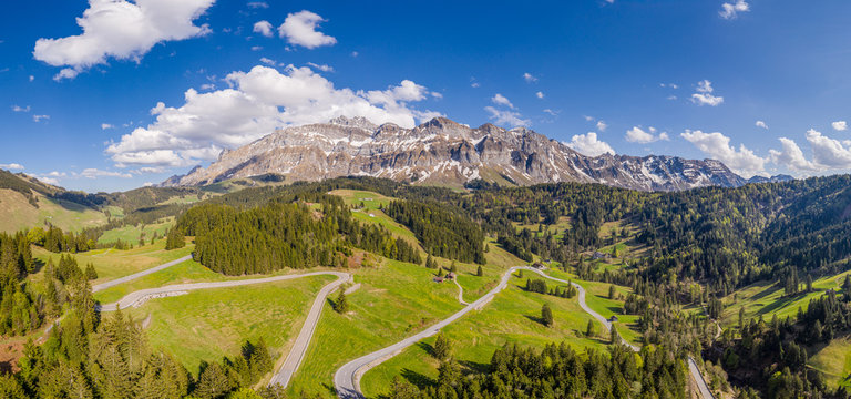 Aerail view of the S&auml;ntis (or Santis) mountain range landscape and schw&auml;galp pass in Canton Appenzell in Switzerland on a sunny spring day