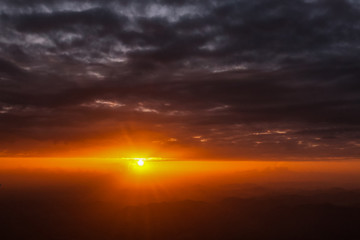 Sunset sunrise orange landscape in dramatic cloudy heaven sky aerial view