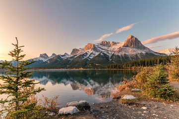 Sunrise on Mount Rundle with colorful sky reflection on Rundle Forebay reservoir in autumn at Canmore © Mumemories
