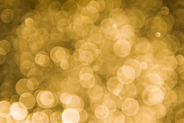 abstract gold background with soft blur bokeh light effect, background bokeh