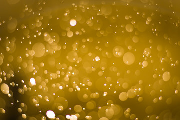 abstract gold background with soft blur bokeh light effect, background bokeh