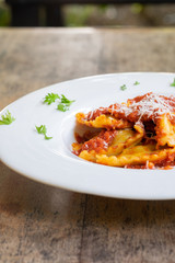 Fototapeta premium Ravioli with tomato sauce