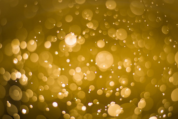 abstract gold background with soft blur bokeh light effect, background bokeh