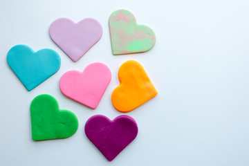 heart shaped candies on wooden background