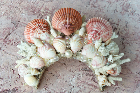 crown of shells on a textured background with blur for photo collage