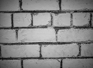 Isolated monochrome close-up of dramatic old wall background built with white bricks and gray concrete