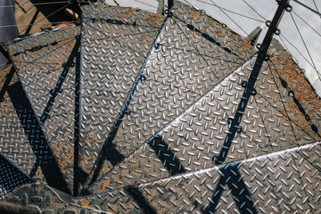 Metal spiral staircase light shadow relief