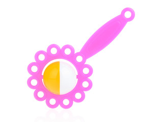 Children's plastic rattle pink on a white background. A toy to attract the child's attention. Development of hearing and attention in children
