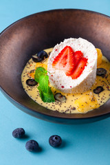 Cottage cheese bowl with mango smoothie, chia seeds, blueberries, strawberries