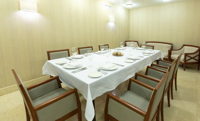 VIP room in restaurant with white tablecloth