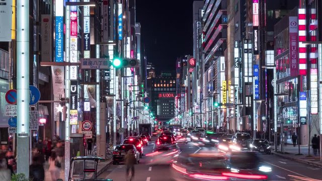 Ginza Central Street at rush hour. Ginza is recognized by many as one of the most luxurious shopping districts in the world. 4K night time lapse