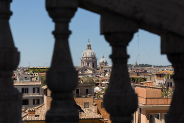 views of Rome between the railings of a terrace