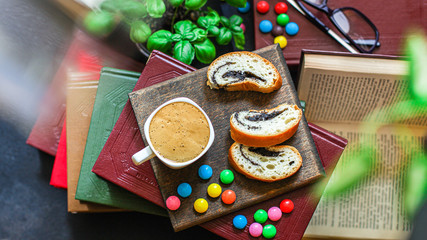 cup of coffee and bun dessert, reading books Menu concept. food background top view copy space for text