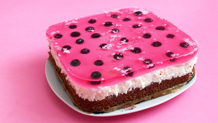 delicious blueberry cake on a pink background