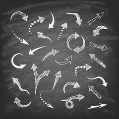 Vector illustration of hand drawn doodle arrows. Set of icons on the chalkboard background.