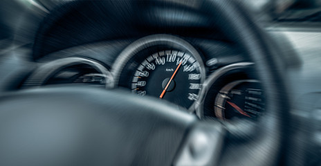 Car speedometer. High speed on a car speedometer and motion blur.