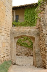 Arch at cobbled street in Girona village