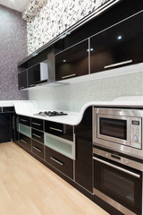 Modern kitchen interior with fridge and oven