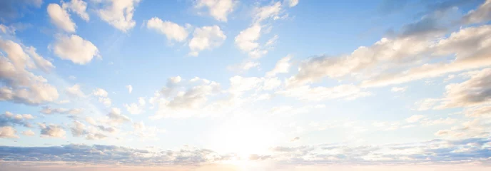 Foto auf Acrylglas Blue sky clouds background. Beautiful landscape with clouds and orange sun on sky © millaf