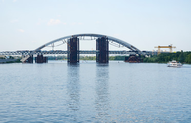View of Podolsky Metro Bridge over the Dnipro river. This is a combined road-rail bridge under construction in Kyiv Ukraine