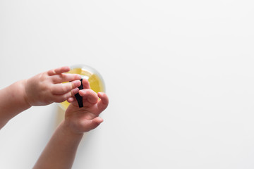 baby child washing hands with antibacterial liquid soap dispenser. Coronavirus (Covid-19) preventive measures top view concept - top view - flat lay - banner