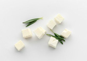 Tasty cut feta cheese on white background - obrazy, fototapety, plakaty
