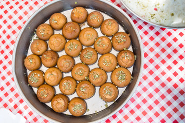 Lokma, Turkish street food dessert. Bites flavoured with honey, sugar syrup