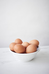 Minimalistic close up of eggs in bowl © 4Media Creations