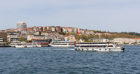 Fototapeta premium Istanbul, Turkey - a natural separation between Europe and Asia, the Bosporus is a main landmark in Istanbul. Here in particular a glimps of its waters and buildings