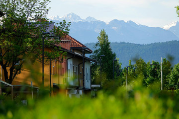 CLOSE UP: Scenic shot of a row of colorful houses under the scenic mountains