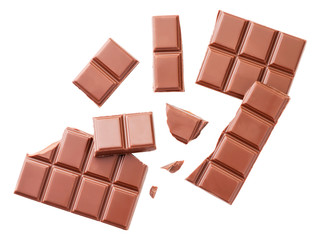 Chocolate bar broken into pieces on a white background isolated. The view from top