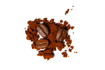 Ground coffee and roasted beans on a white background, isolated. Chocolate color of Robusta coffee.