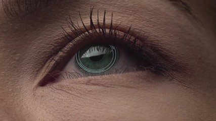 Green female eye with augmented reality virtual inaterface close up shot. Face id.