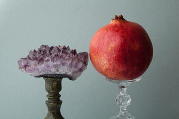 Semi-precious stone amethyst and ripe pomegranate