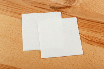 white paper napkin with a textured pattern on an old table